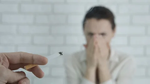 The woman is choking on cigarettes. Stock Footage 126861440