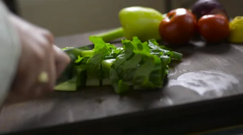 Woman chopping lettuce Stock Footage 57238323