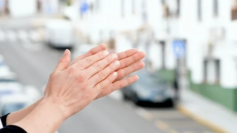 Woman clapping hands to the doctors, nurses, police and all those who are fig Stock Footage 129076787
