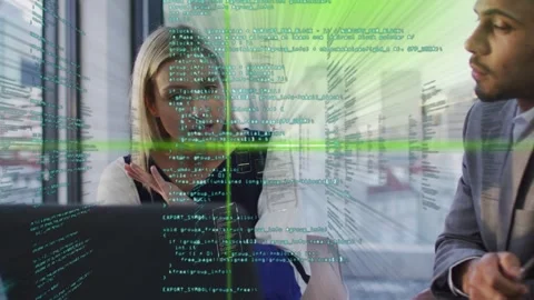 Woman clarifying code by gesturing at laptop, man listening, AR code green lines Stock Footage 333936390