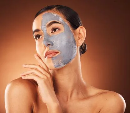 Woman, clay face mask and beauty, facial makeup and detox dermatology on studio Stock Photos