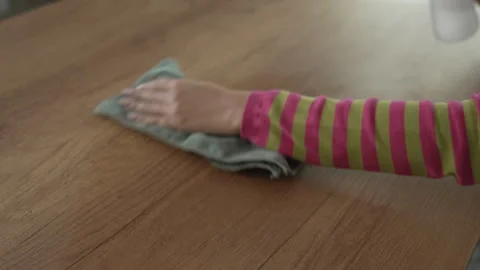Woman clean the dust from table with microfiber Stock Footage 292556387