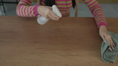 Woman clean the dust from table with microfiber Stock Footage 292556401