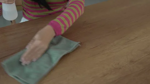 Woman clean the dust from table with microfiber Stock Footage 292556564