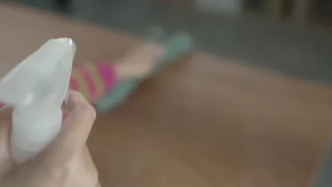 Woman clean the dust from table with microfiber Stock Footage 292557217