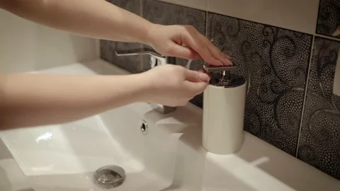 Woman clean hands during COVID19 Stock Footage