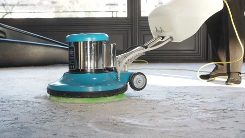 Woman cleaner using polishing machine to clean floor Stock Footage 168599800