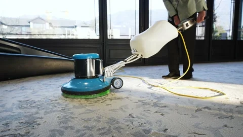 Woman cleaner using polishing machine to clean floor Stock Footage 168599869