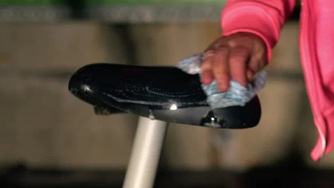 Woman cleaning exercise machine Stock Footage 280498393