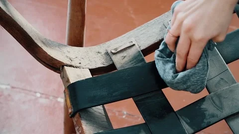 Woman cleaning the furniture. Old chair repair. Stock Footage