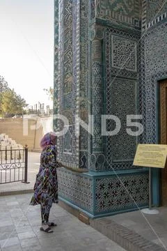 Woman cleaning Khodja Ahmad Mausoleum at the Shah-i-Zinda Ensemble, Samarkand Stock Photos