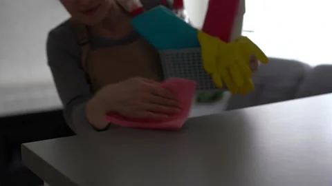 Woman cleaning table using rag and diffuser at home. Stock Footage 238543205