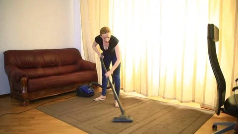 Woman cleaning using vacuum cleaner, effective. Vacuum cleaner carpet Stock Footage 74907090
