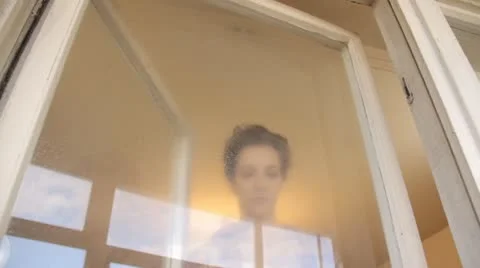 Woman cleaning window Stock Footage 12269630
