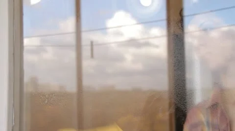 Woman cleaning window Stock Footage 12269694