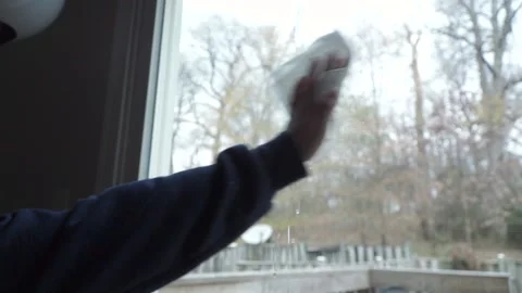 Woman Cleaning Window Stock Footage