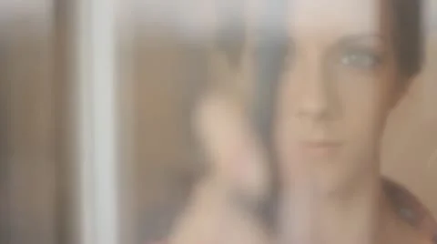 Woman cleaning window sequence Stock Footage 12281947