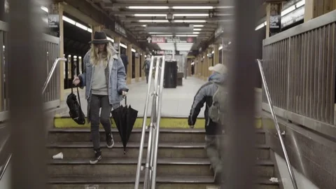 Woman climbing down the stairs of Stock Video Pond5