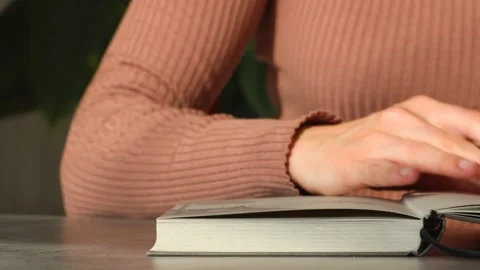 Woman closed notebook and put hand on top of the cover Stock Footage 165101041