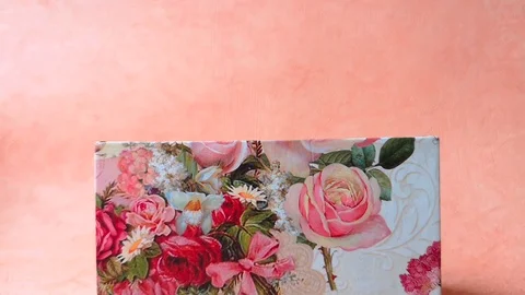 Woman closes small rectangular gift box, zoom Stock Footage 103850793