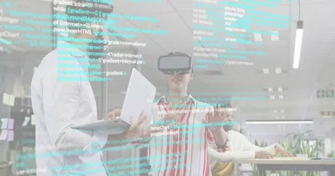 Woman coder wearing VR headset initiating code editing while team viewing Stock Footage 318092598