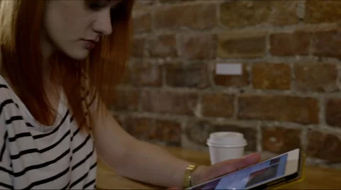 Woman with coffee and tablet Stock Footage