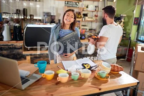 Woman coffee owner with open sign.. Stock Photos
