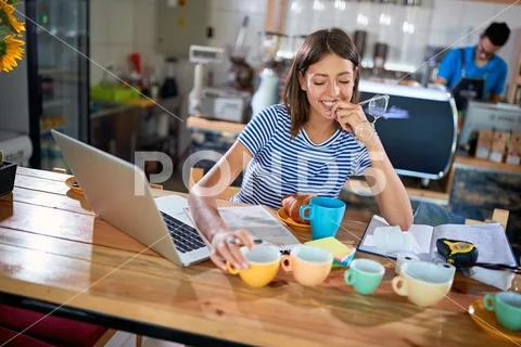 Woman coffee owner working to open her cafe.. Stock Photos