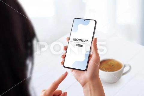 Woman in a coffee shop using a smartphone  mockup PSD Template