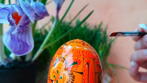 Woman is coloring easter egg Stock Footage 103848271