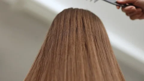 Woman combing long brown gray hair by brush, concept hair health, natural hair Stock Footage 242589178