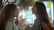 Woman Comforting Her Scared Friend On The Street At Night Stock Footage