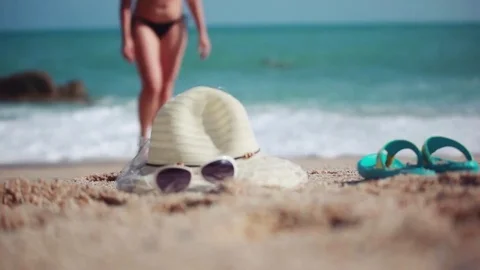 Woman coming from the sea. Close up of her feet. 1920x1080 Stock Footage