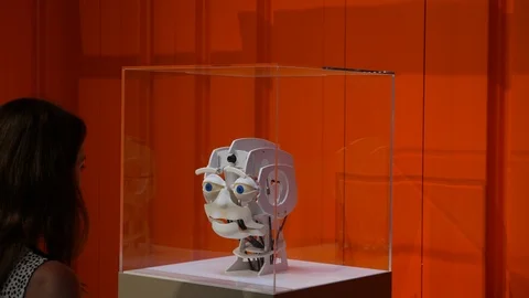 Woman communicate with robot head Stock Footage 94956653