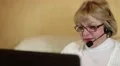 Woman communicates via laptop HD Footage