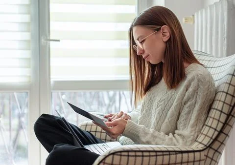 Woman comparing material samples for interior design project Stock Photos