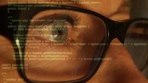 A woman compiling code by a computer. Text blurry Stock-Footage 122825933