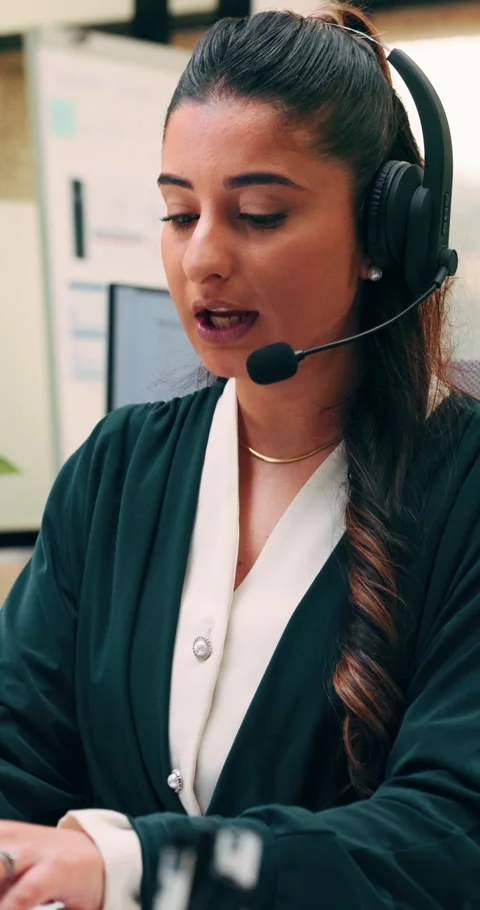 Woman, computer and headset at call center with discussion, review or explain at Stock Footage 336327038
