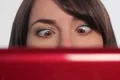 Woman at computer. Crossed eyes. SD. Footage