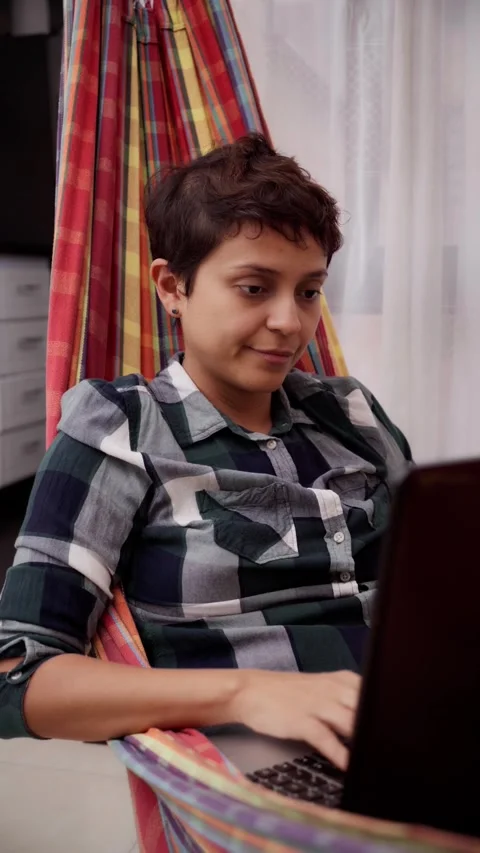Woman computer hammock vertical Video stock 276379650