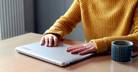 Woman Concerned About Excessive Use Of Internet Closing Lid Of Laptop Computer Stock Footage