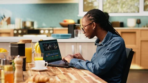 Woman content creator editing clips footage for video production at home Stock Footage 344246321