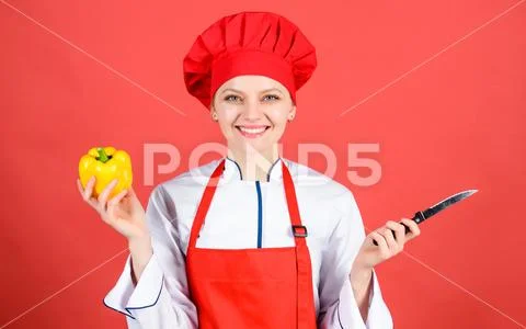 Woman in cook hat and apron. professional chef in kitchen. Cuisine. Housewife Stock Photos
