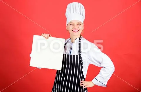 Woman in cook hat and apron. professional chef in kitchen. Cuisine. restaurant Stock-Fotos