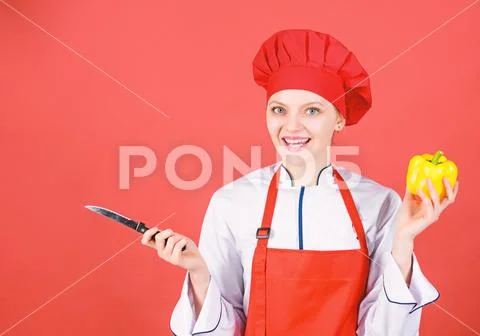 Woman in cook hat and apron. professional chef in kitchen. Cuisine. sweet pepper Stock-Fotos