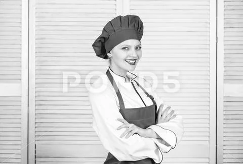 Woman in cook hat and apron. professional chef in kitchen. Cuisine. happy woman Stock-Fotos