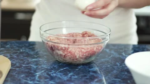 Woman cooking cutlets in the kitchen Stock Footage