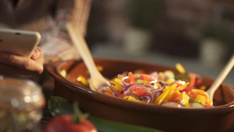 Woman cooking in the kitchen and using a digital tablet Stock Footage 128689569