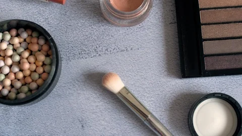 Woman cosmetics make up stuff on texture surface. Eye shadows palette and brushe Video stock 114294411