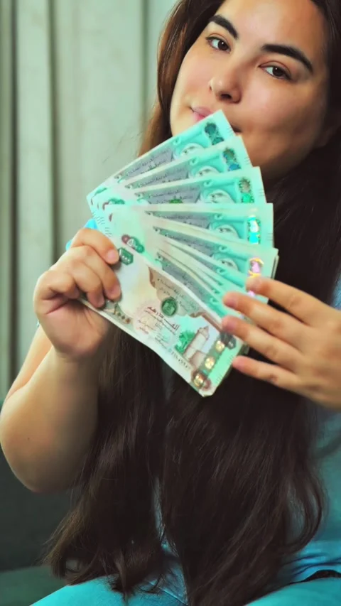 Woman Counting AED Dirhams in hands, closeup. Video stock 286349602